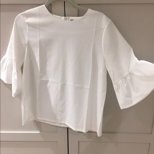 white trumpet sleeve blouse